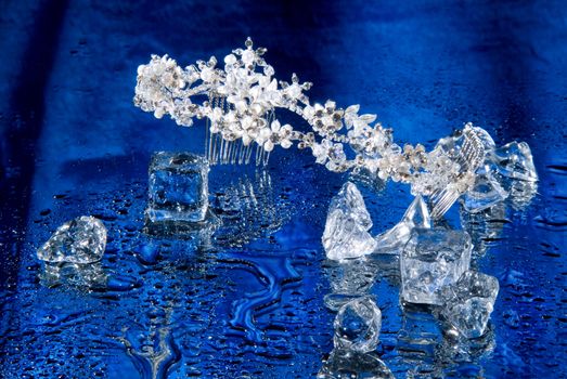 Jewelry and crystals of ice on a glass background
