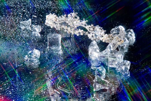 Jewelry and crystals of ice on a glass background