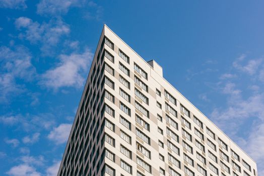 Angle of the Skyscraper on the Cloudy Sky Background.