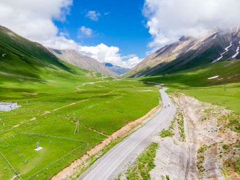 Georgian Military Road surrounded by high picturesque mountains, beautiful scenery of Georgia, Caucasus