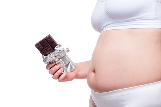 female fat belly in underwear with chocolate and isolated on white background