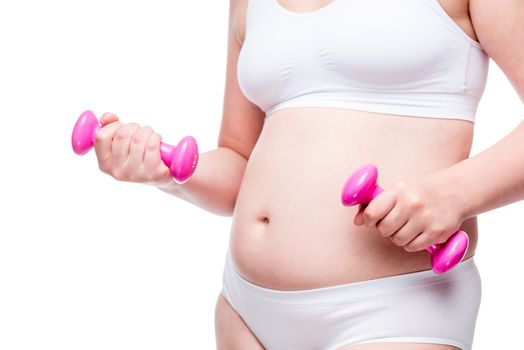 woman in white underwear with pink dumbbells, fat belly closeup isolated