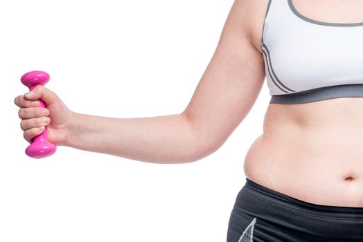 female hand with dumbbell and fat belly closeup on white background