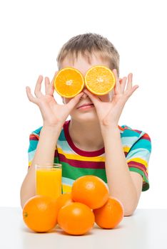 humorous photo of a boy with oranges and fresh juice on a white background is isolated