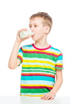 child drinks milk from a glass, portrait of a healthy boy concept photo healthy food