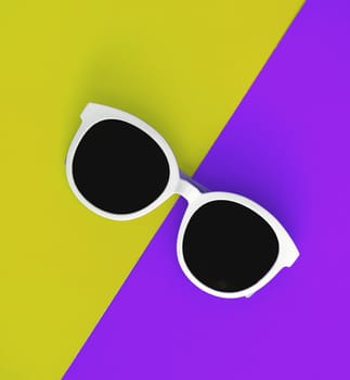 Sunny stylish white sunglasses on a bright purple-lilac and yellow-green background, top view, isolated. Copy space. Flat lay.