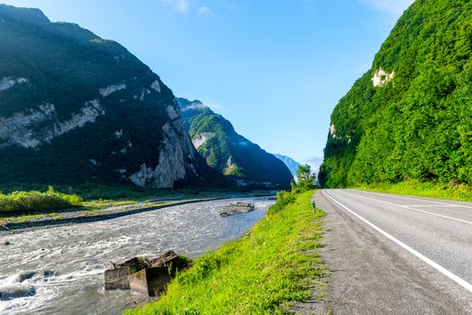 Mountain road along the river in the mountains of the Caucasus, Georgia