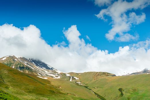 Green mountains with snow caps in June, Caucasus, Georgia