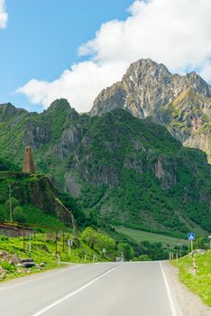 Vertical photo of the Caucasus landscape, view of the mountains and the road