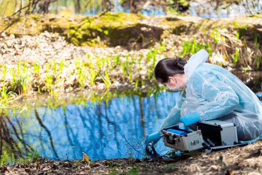 a chemist conducts a study of water from a natural source in the forest, identifying an epidemic