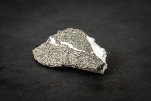 Piece of rock containing natural asbestos parts found in nature