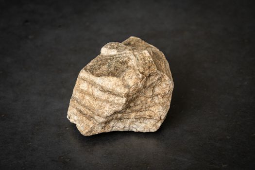 Piece of hard ground rock of Manhattan granite ground rock