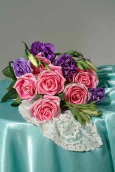 Bouquet of flowers on a fabric studio background