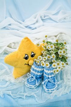 Still life with bouquet of flowers and accessories on a studio background