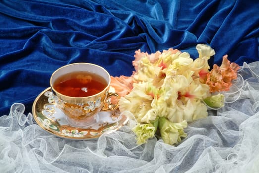 Still life with bouquet of flowers and accessories on a studio background