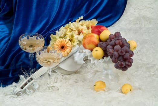 Still life with bouquet of flowers and accessories on a studio background