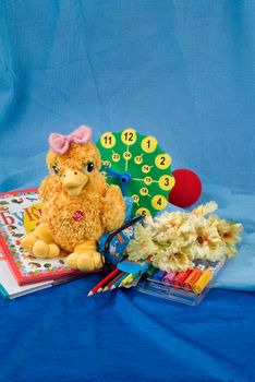 School books and accessories on a studio background