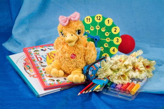 School books and accessories on a studio background