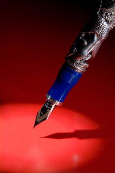 Pen and shadow on a studio background