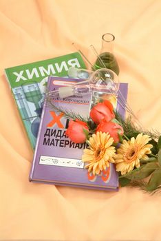 School books and accessories on a studio background