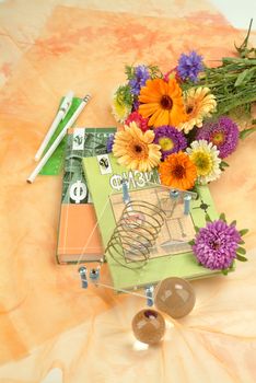 School books and accessories on a studio background