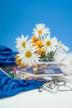 School books and accessories on a studio background