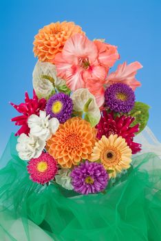 Still life with bouquet of flowers and accessories on a studio background