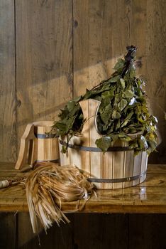 Russian traditional bath accessories on a wooden background