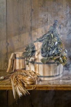 Russian traditional bath accessories on a wooden background