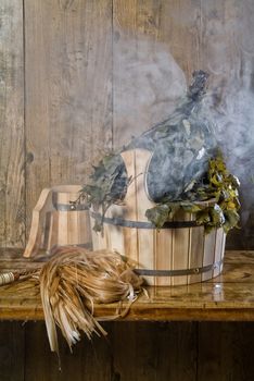 Russian traditional bath accessories on a wooden background