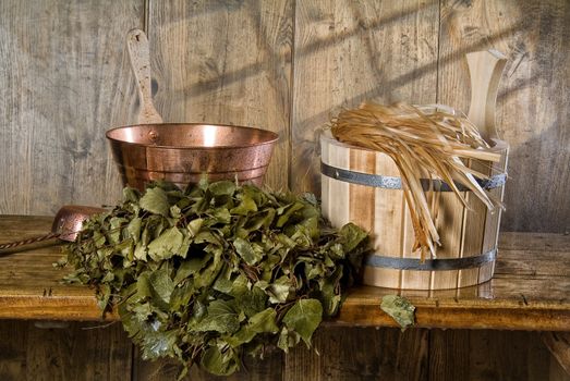 Russian traditional bath accessories on a wooden background