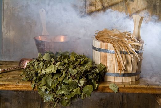 Russian traditional bath accessories on a wooden background