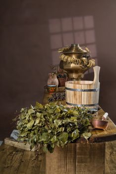 Russian traditional bath accessories on a wooden background