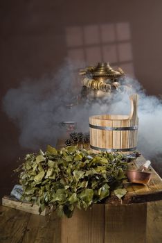 Russian traditional bath accessories on a wooden background