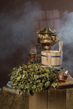 Russian traditional bath accessories on a wooden background