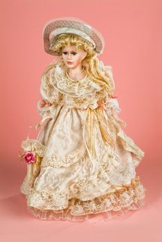 Doll dressed in retro style on a studio background