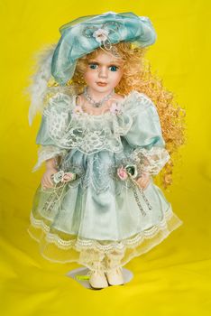 Doll dressed in retro style on a studio background