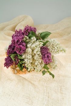 Still life with bouquet of flowers and accessories on a studio background