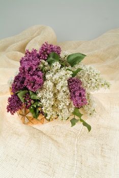 Still life with bouquet of flowers and accessories on a studio background