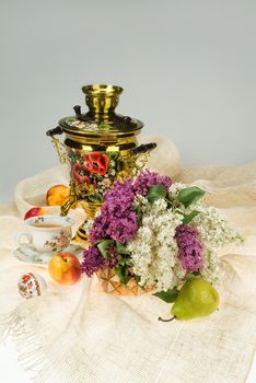 Still life with bouquet of flowers and accessories on a studio background