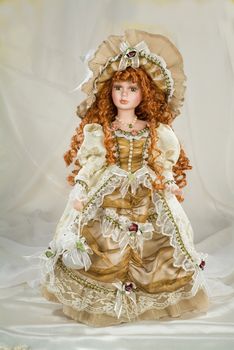 Doll dressed in retro style on a studio background
