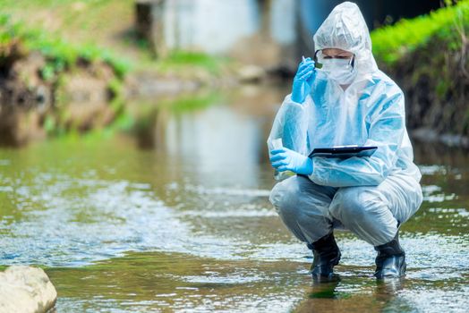 Photos chemist takes water samples