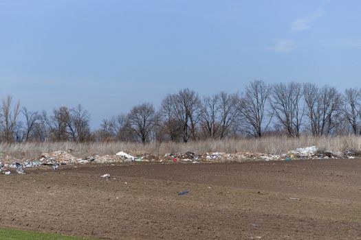 Trash on the agriculture field. Ecology problem and big harm to nature. 
