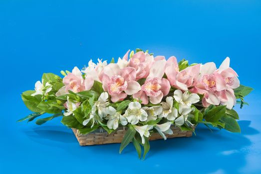 Still life with bouquet of flowers and accessories on a studio background