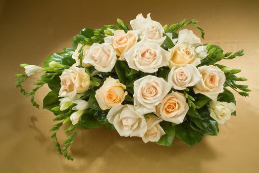 Still life with bouquet of flowers and accessories on a studio background