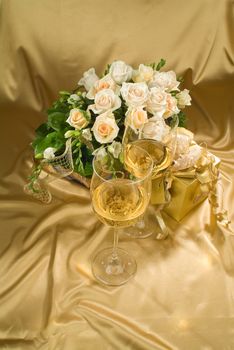 Still life with bouquet of flowers and accessories on a studio background