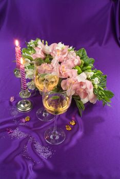 Still life with bouquet of flowers and accessories on a studio background