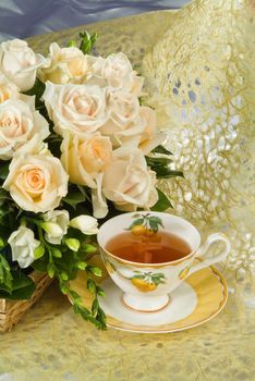 Still life with bouquet of flowers and accessories on a studio background