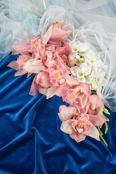 Still life with bouquet of flowers and accessories on a studio background