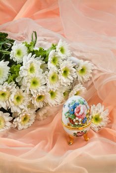 Still life with bouquet of flowers and accessories on a studio background